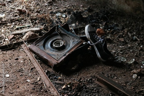 Wallpaper Mural Closeup shot of a broken camera and an old sneaker Torontodigital.ca
