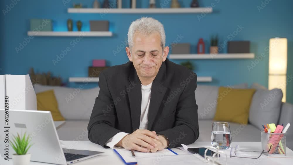 Home office worker man looking emotional at camera. Home office worker man looking emotional at camera.