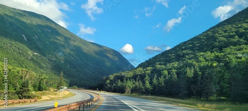 Canvas Print Rural road leading to the green mountains