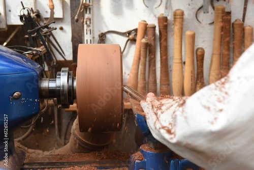 Closeup view of the process of making a wooden bowl on a woodturning machine