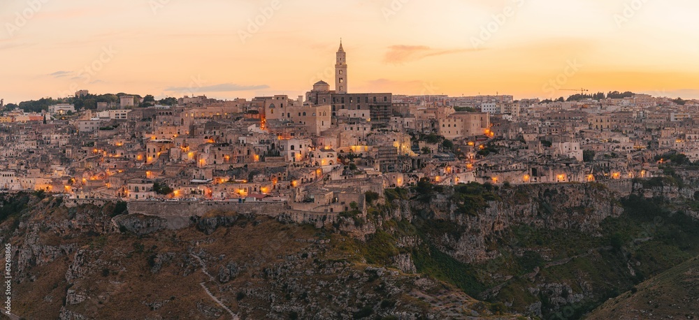 Aerial panoramic view of Sassi di Matera historical place against sunset sky in Matera, Italy