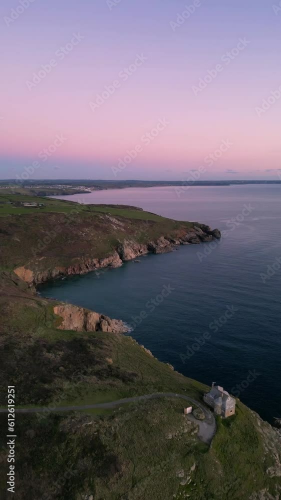 Aerial view of Rinsey Head in coastal cliffs against the sea in Cornwall, UK at sunset Aerial view of Rinsey Head in coastal cliffs against the sea in Cornwall, UK at sunset