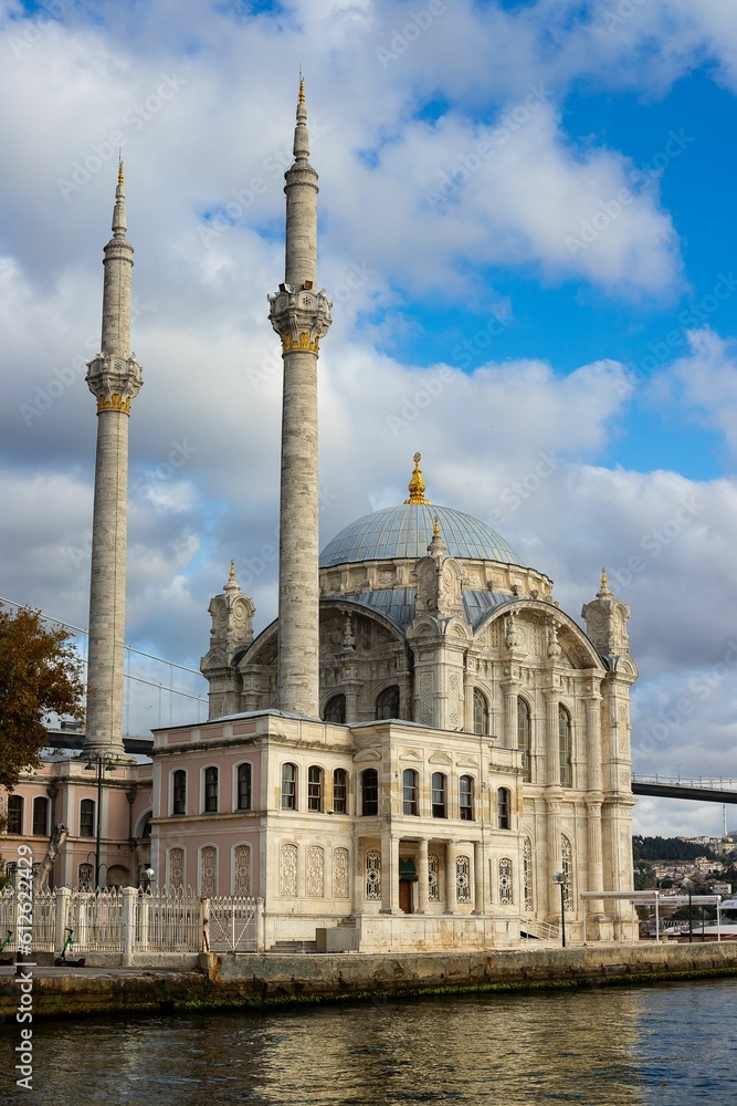 Vertical shot of the Grand Mecidiye Mosque under the clouds in Istanbul, Turkey