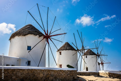 Beautiful shot of the Windmills of Mykonos under the clouds in Greece