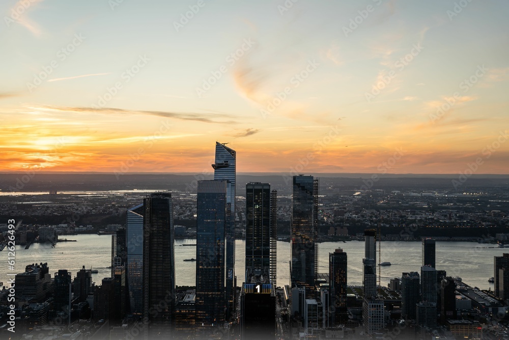 Drone shot of skyscrapers in New York City against dusk sky, United States of America