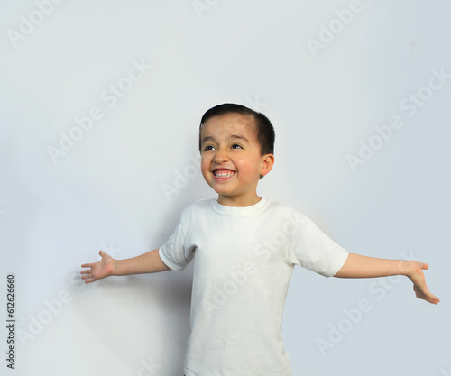 beautiful child, 5 year-old kid, Open arms, Big smile, straight black hair, latin boy, Mexican, light skin, pink cheeks, White shirt, White background, Worshipping, open hands