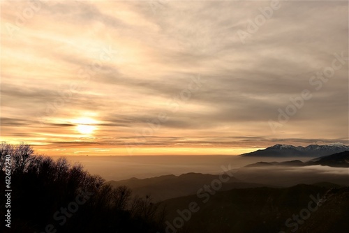 Fototapeta Naklejka Na Ścianę i Meble -  Beautiful view of a sunset over the mountains.