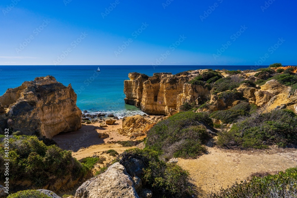 Scenic view of a beautiful coastal cliff seen from the shore of a beach
