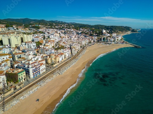 Aerial shot of buildings by the coast in Barcelona  Spain on a sunny day
