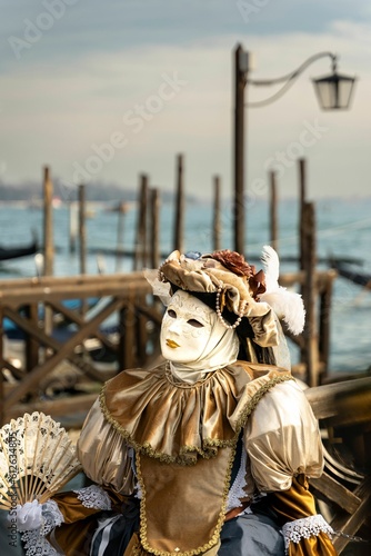 Person wearing a traditional costume, celebrating the Carnival of Venice © Jakob Bagterp/Wirestock Creators