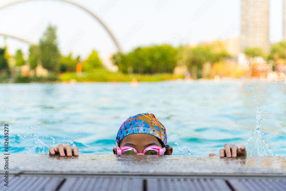 happy Asian little girl in swimming pool Stock Photo | Adobe Stock