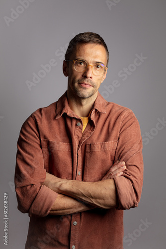 Casual man with crossed hands photo