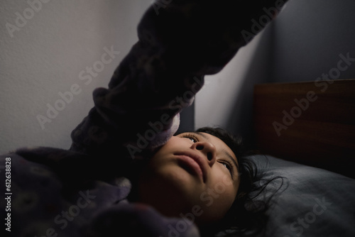 Teenage Girl Lying On Bed photo