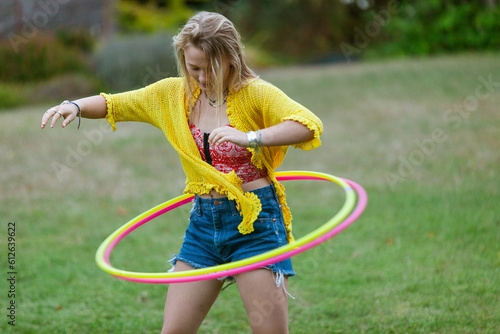 Woman moving double hula-hula in nature photo