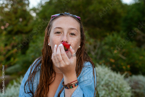 Funny Girl eating strawberry