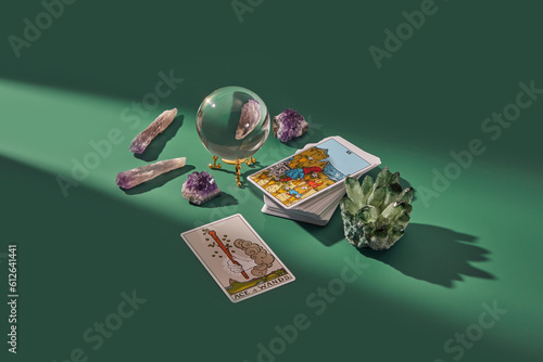 Deck of tarot cards, crystal ball and magic quartz.