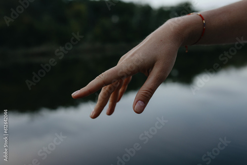 Female Hand above the water photo