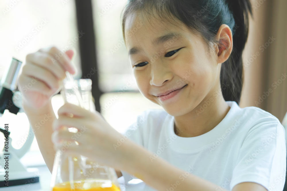 Little child with learning science class in school laboratory Little child with learning science class in school laboratory