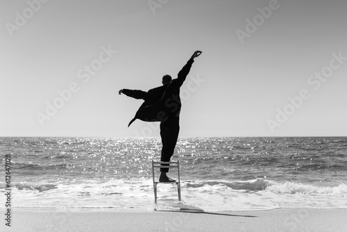 aesthetic Man dancing at beach photo