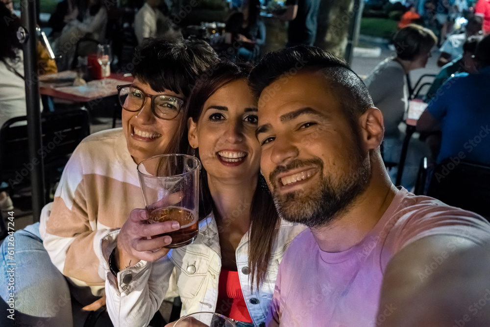 selfie of friends having fun at a bar terrace selfie of friends having fun at a bar terrace