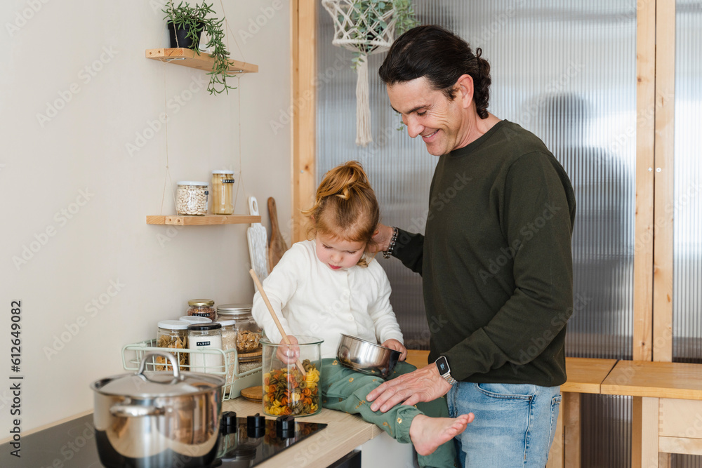 Dad And Daughter Cooking Together At Home Dad And Daughter Cooking Together At Home