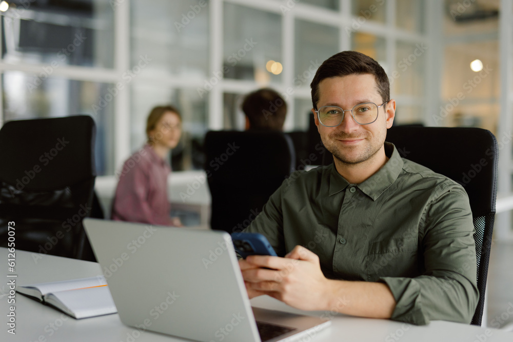 Confident manager working laptop contemporary workspace Confident manager working laptop contemporary workspace