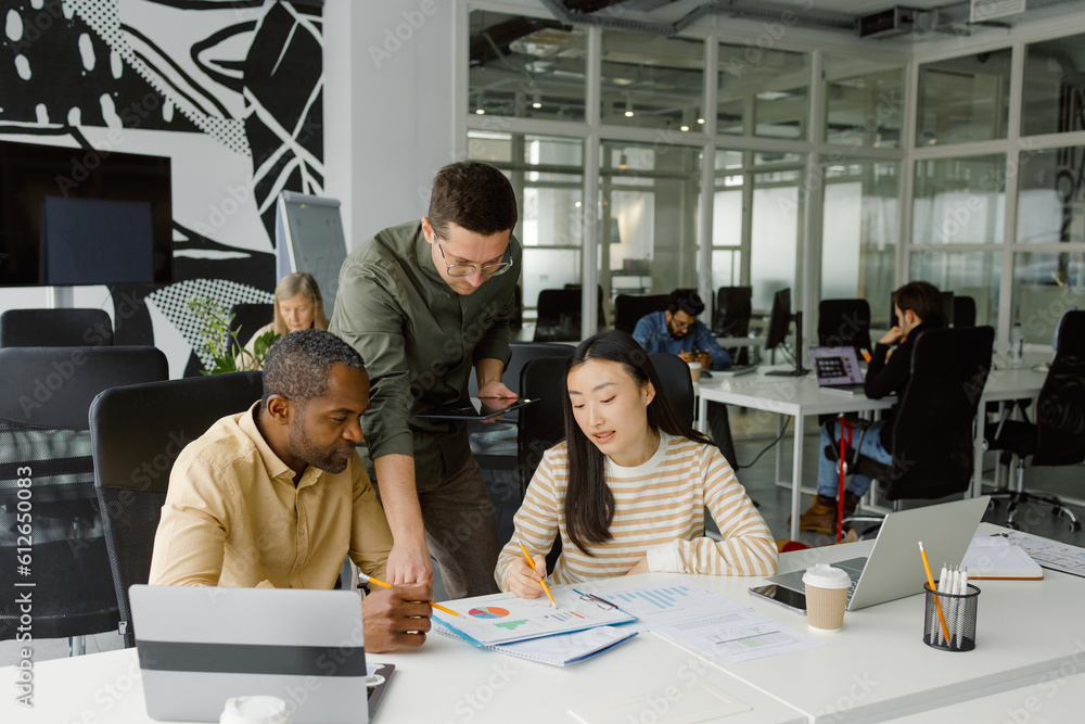 © Oleksii Syrotkin/Stocksy - Corporate managers discusses strategy workspace meeting © Oleksii Syrotkin/Stocksy - Corporate managers discusses strategy workspace meeting