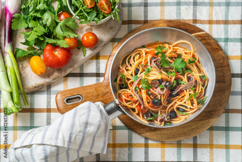 PAsta in tomato sauce, olives and anchovies photo