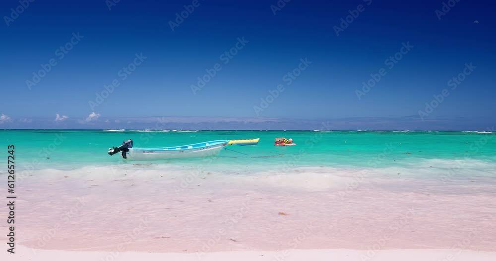 Tropical caribbean sea and beach and speed boat sail in water, Dominicana, Dominican Tropical caribbean sea and beach and speed boat sail in water, Dominicana, Dominican