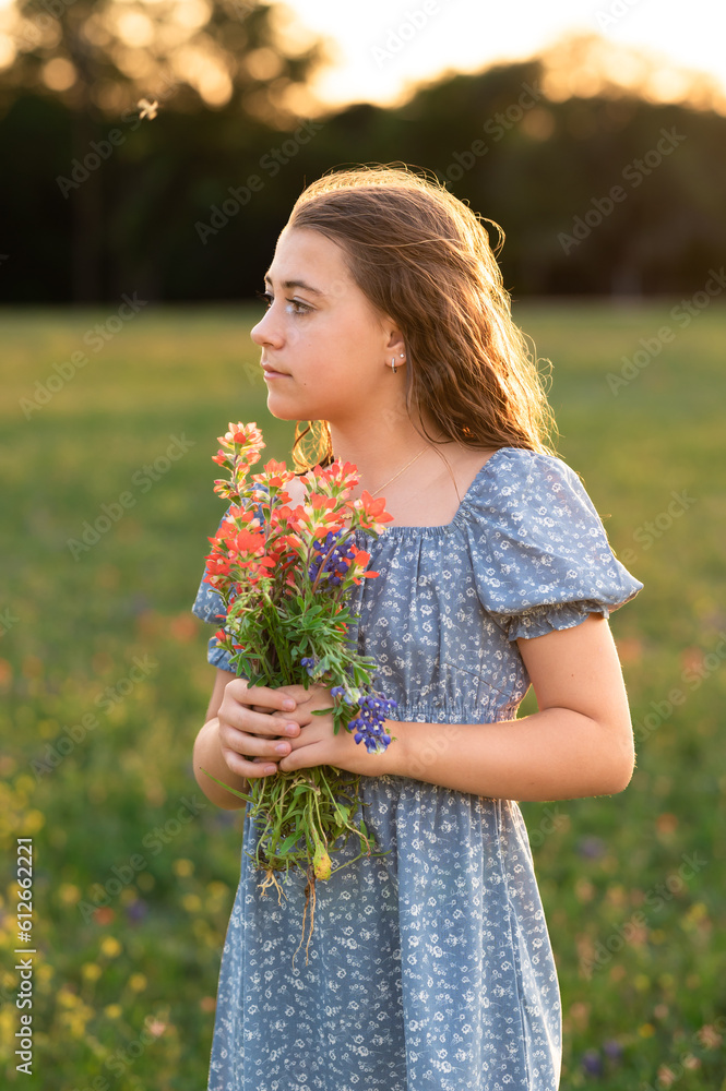 Profile of pre-teen with flowers Profile of pre-teen with flowers