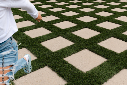 Person runs across concrete pavers