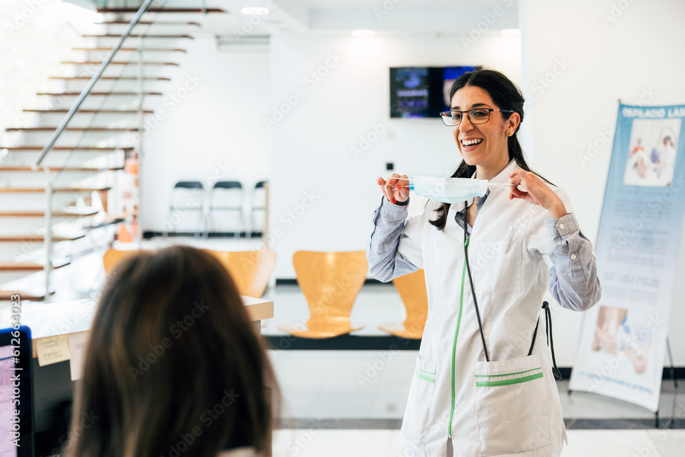 © VICTOR TORRES/Stocksy - Happy woman in medical uniform during work in clinic © VICTOR TORRES/Stocksy - Happy woman in medical uniform during work in clinic