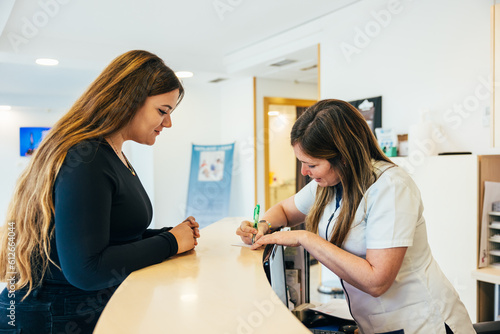 Wallpaper Mural Nurse writing notes on paper near patient Torontodigital.ca