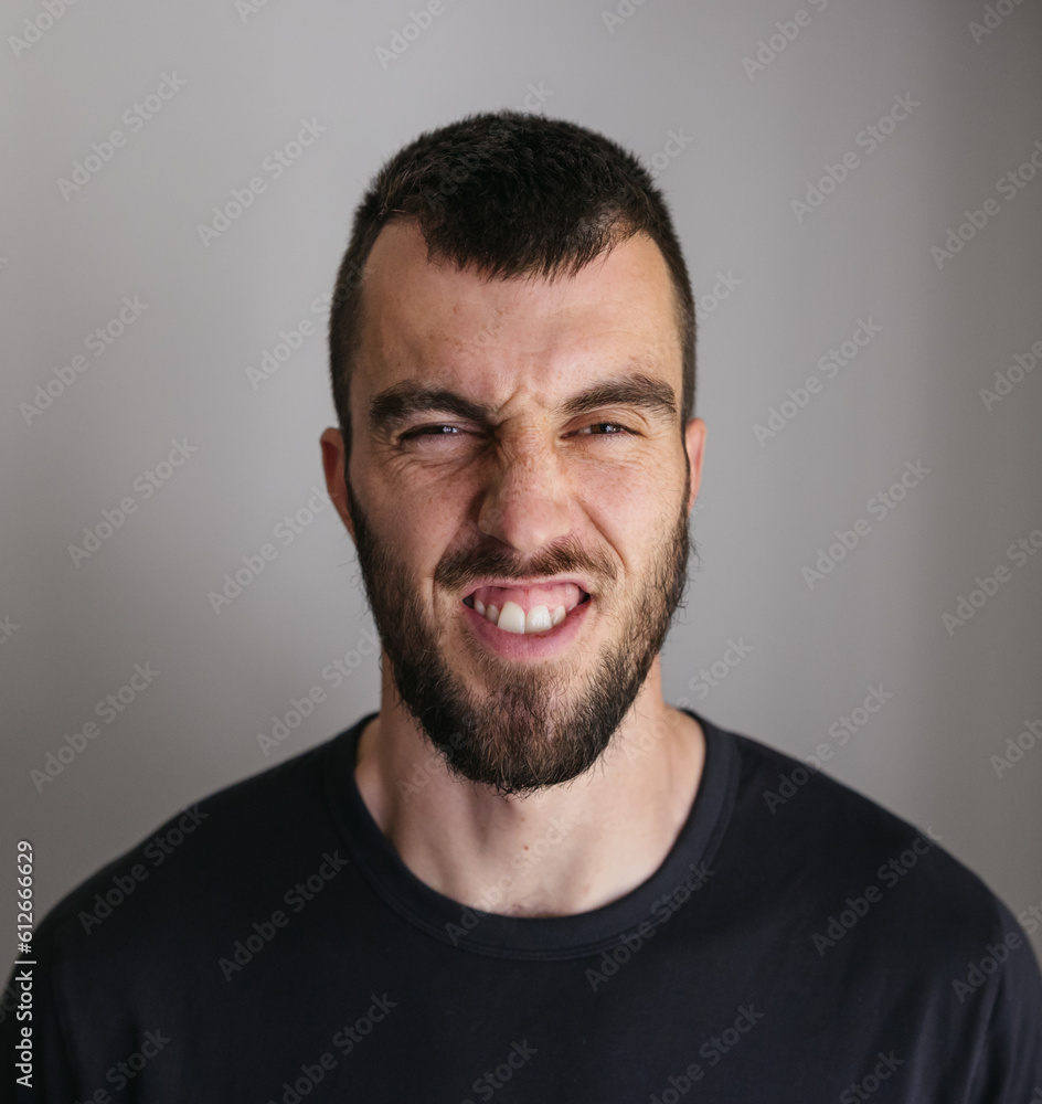 Scrunchy face studio portraits of visually impaired man. Scrunchy face studio portraits of visually impaired man.