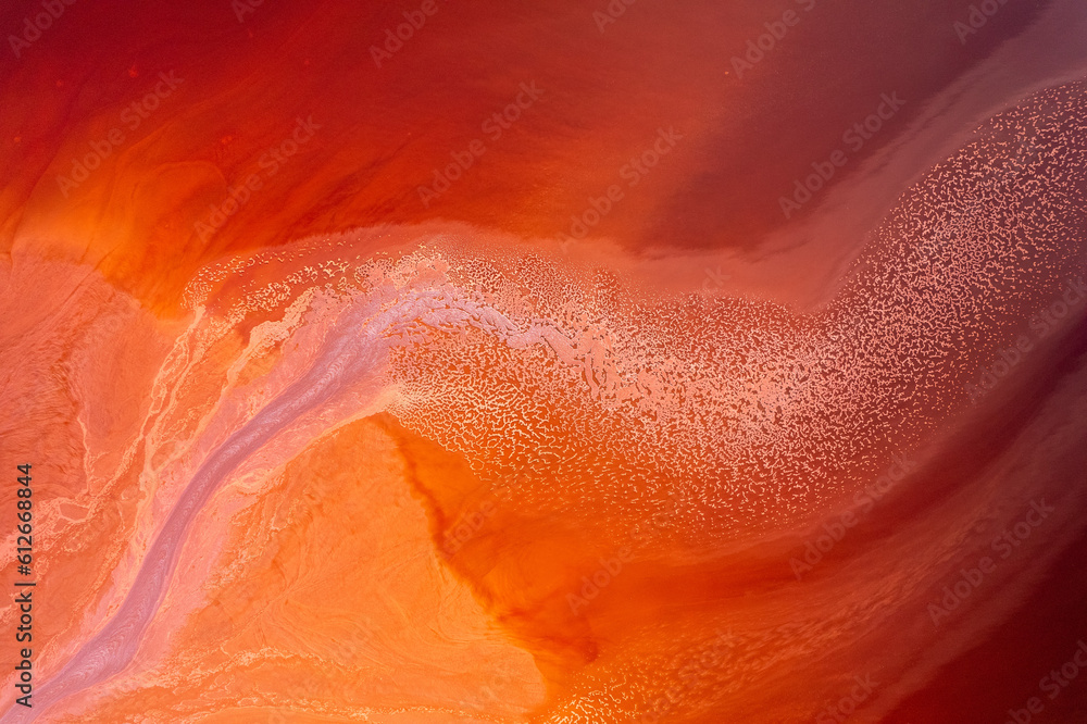 © Elena Saurius & Dani Rex/Stocksy - Abstract water on vibrant orange and red colors. Top view