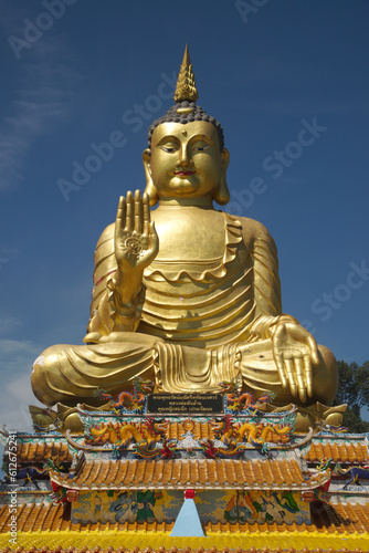 Pra Put Ratanamani Srihathai Naresuan or Luang Por Pan Lan large golden sitting outdoor Buddha in Wat Maniwong. It is a beautiful and faithful Buddha image. Located at Nakhon Nayok Province in Thailan