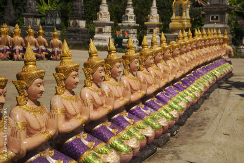 Statues of angels lined up in rows, beautiful, guarding and decorating the place at Wat Maneewong Temple. This is a travel to pay homage for sacred thing.