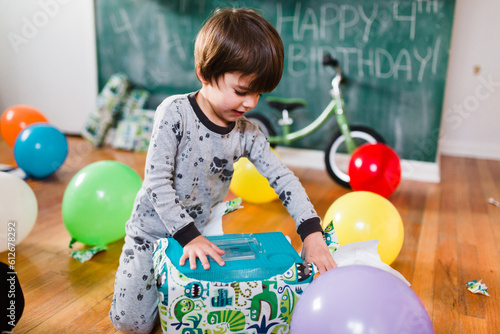 Boy opening presents for birthday