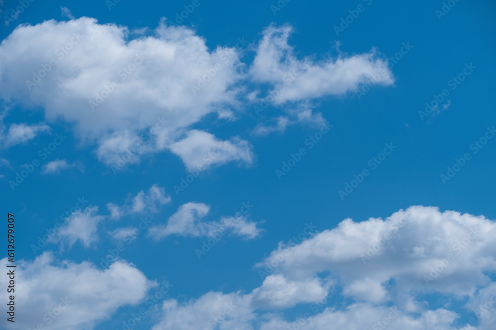 Natural background of blue sky and white clouds. Beautiful high summer sky Natural background of blue sky and white clouds. Beautiful high summer sky