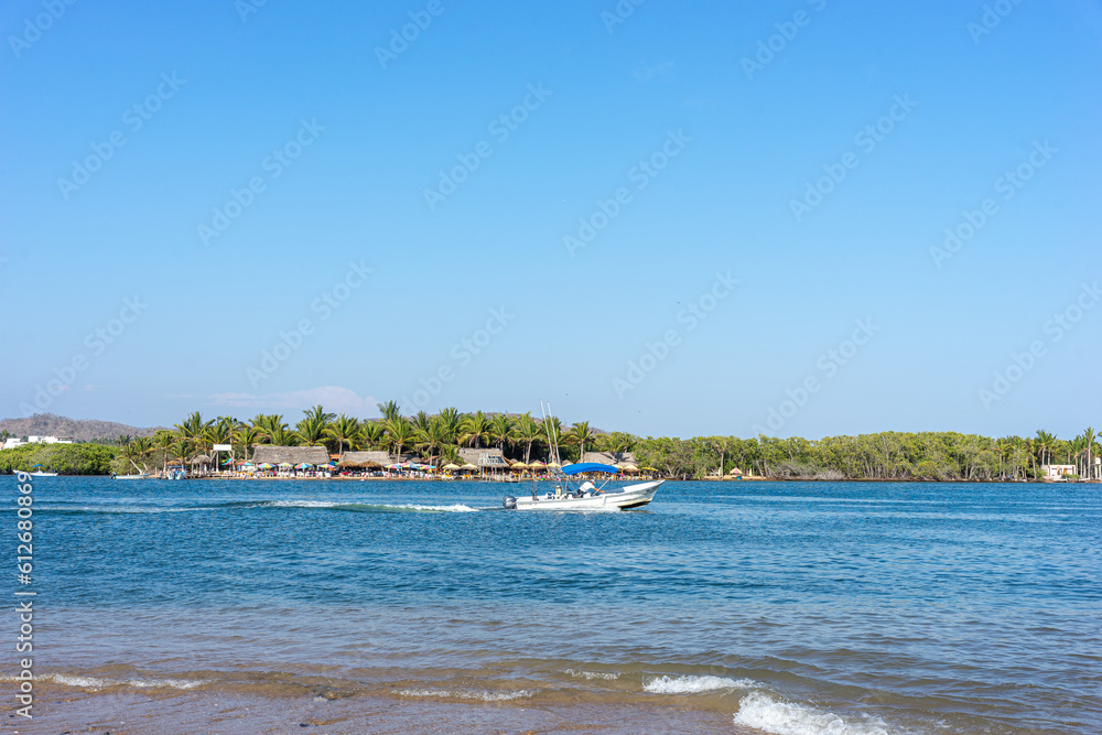 Fototapeta premium Boardwalk of Barra de Navidad beach, cihuatlan, Jalisco, mouth of river, Melaque Beach, Costalegre, cabo of mexico, bay of navidad.