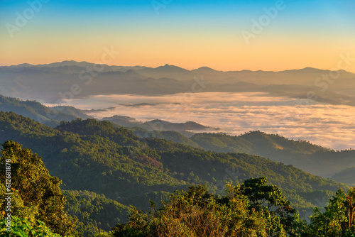 Tropical forest nature landscape view with mountain range sunrise with moving cloud mist at Huai Nam Dang National Park, Chiang Mai Thailand
