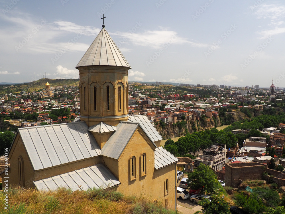 Obraz premium Panorama of Tbilisi, Georgia, with a stunning view of a church.