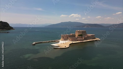 Bourtzi Castle Island with the Greek port city of Nafplio in the background photo