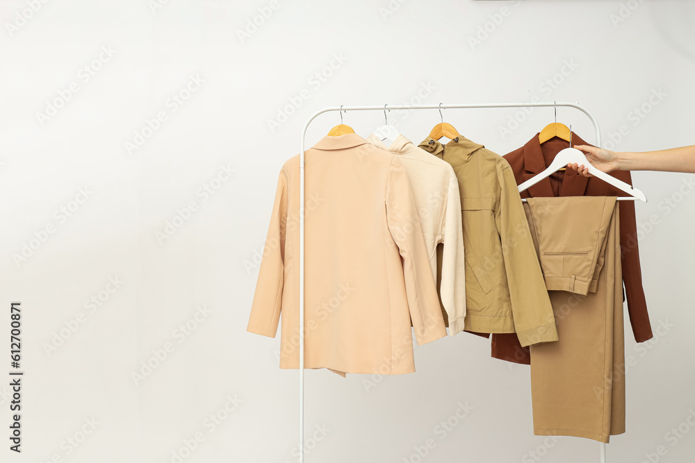 Wardrobe rack with different clothes, concept of different clothes Wardrobe rack with different clothes, concept of different clothes