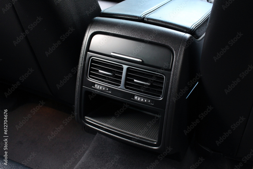 Rear passenger air vent of modern luxury car. Air vents in the rear