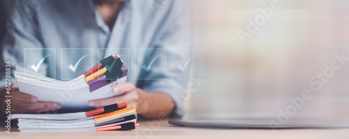 Accountant showing office document auditing concept ,plan review process and assess correctness ,Management of important document storage of organization ,document system ,accountant Audit documents