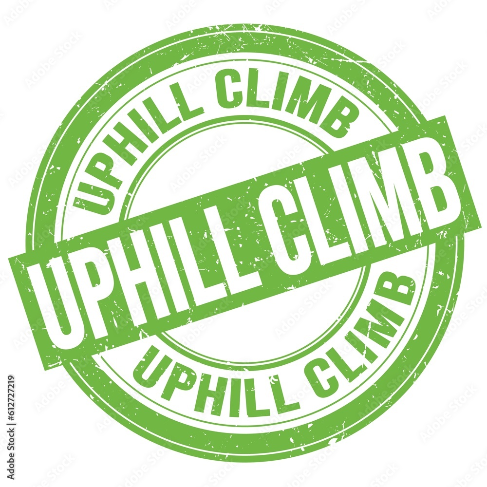 UPHILL CLIMB text written on green round stamp sign UPHILL CLIMB text written on green round stamp sign