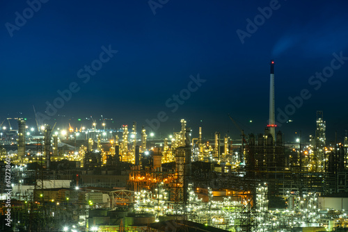 aerial view oil refinery Oil and gas industry  petrochemical plant area and energy concept  oil storage tanks at night time with lights.