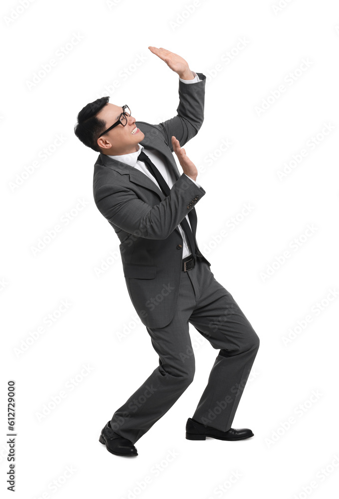 Scared businessman in suit posing on white background