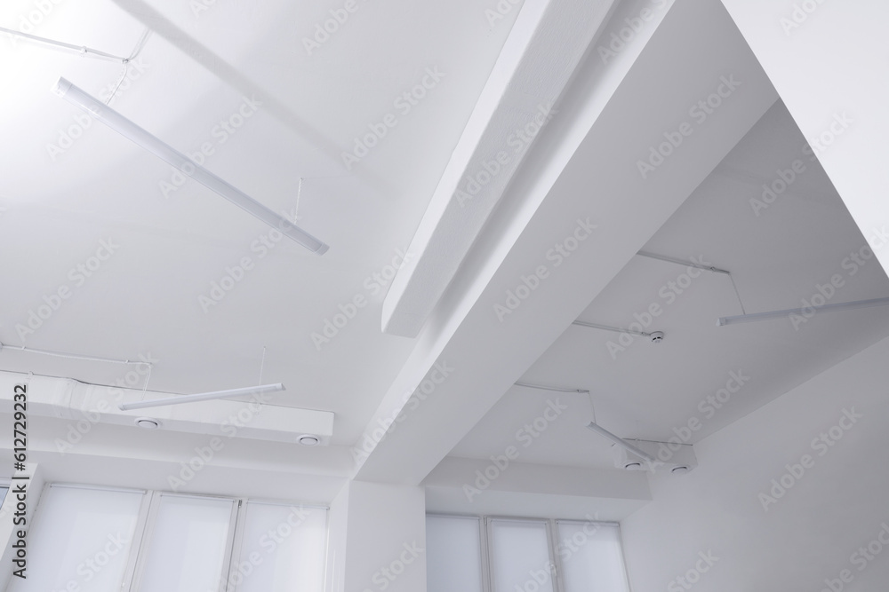Ceiling with ventilation system and lights in room, low angle view Ceiling with ventilation system and lights in room, low angle view